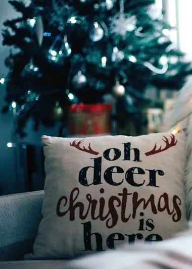 christmas pillow covers next to a christmas tree